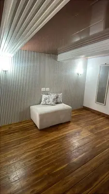 a bed in a room with a wooden floor at Apartamento Cartagena - centro histórico in Cartagena de Indias
