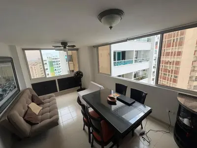 a living room with a table and a couch at Laguito Beach Cartagena in Cartagena de Indias
