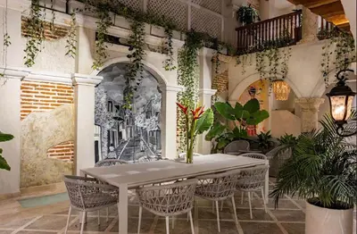 a dining room with a table and chairs at IsaLuna Luxury House in Cartagena de Indias