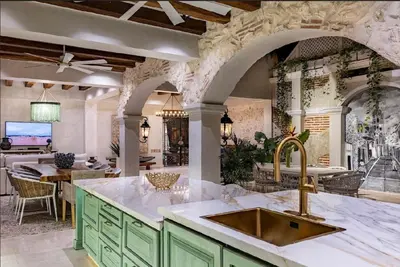 a kitchen with a sink and a counter top at IsaLuna Luxury House in Cartagena de Indias