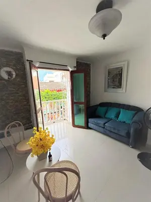 a living room with a couch and a table at Ritze's House Getsemani in Cartagena de Indias