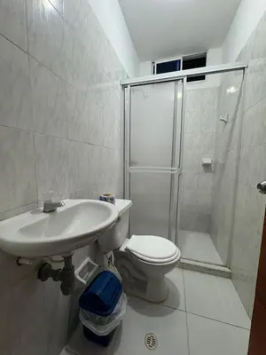 a bathroom with a sink and a toilet and a shower at Un lugar cómodo y acogedor in Barranquilla
