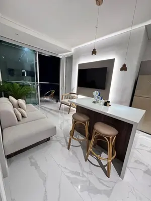 a living room with a couch and a table at Santa marta bello horizonte Swift Lotf in Playa Bello Horizonte