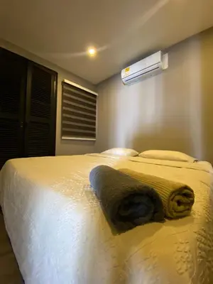 a bedroom with a bed with a towel on it at Apto Torre Centauro, El Laguito in Cartagena de Indias