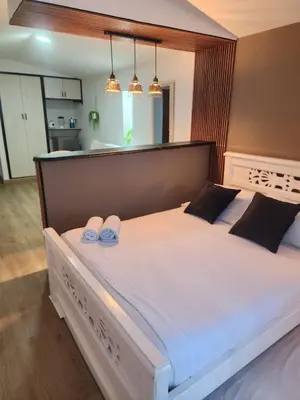 a bedroom with a large bed with two slippers on it at Lindo estudio con espectacular vista in Cartagena de Indias