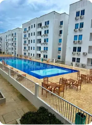 a large swimming pool in front of some buildings at Mirador de la Reserva Coveñas in Coveñas