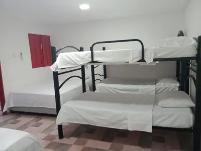 a group of bunk beds in a room at Cabaña villa in Sabanagrande