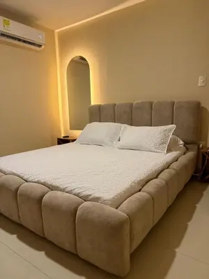a large bed in a room with a large couch at Apartamento en la mejor zona de Barranquilla in Barranquilla