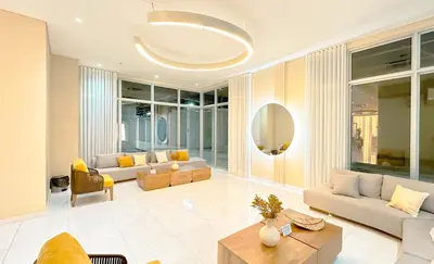 a living room with couches and a table at Charming Oceanfront Apartment with Balcony and Panoramic view, Cartagena Colombia in Cartagena de Indias