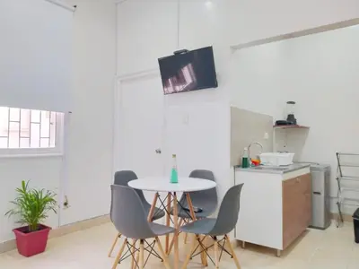 a kitchen with a table and chairs in a room at apto en casa centro historico 3 piso in Cartagena de Indias
