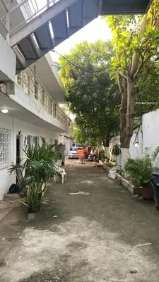 a courtyard of a building with trees and plants at Habitación Privada en La Boquilla in Cartagena de Indias