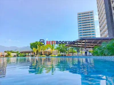 a large swimming pool in front of a building at Santa Marina Luxury Stay - Ocean View in Estación El Salto
