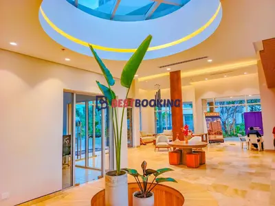 a lobby of a hotel with a sign on the ceiling at Santa Marina Luxury Stay - Ocean View in Estación El Salto