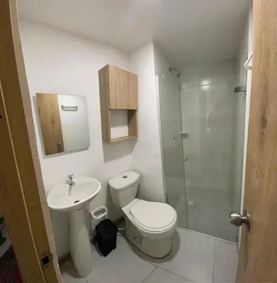 a bathroom with a toilet and a sink and a shower at Enjoy the sun and beach in our apartment in Cartagena de Indias