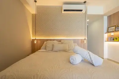 a bedroom with a large bed with a ceiling at Charming Seafront Loft in Cartagena de Indias