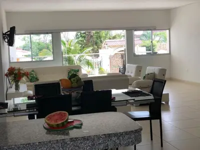a living room with a table with a bowl of fruit at Espectacular casa, vista al mar y piscina privada in Santa Veronica
