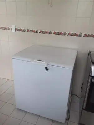 a white refrigerator in a kitchen next to a wall at San Bernardo del Viento Cabaña La Isabela in San Bernardo del Viento