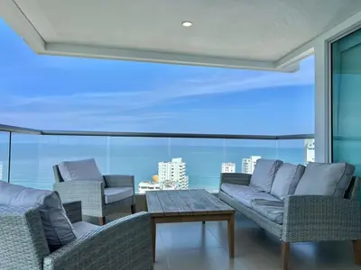 a living room with two couches and a table at Oceanview Bocagrande Laguito Palmetto Sunset Building in Cartagena de Indias