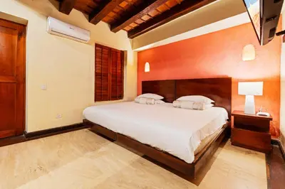a bedroom with a large white bed in a room at Reve hotel in Cartagena de Indias