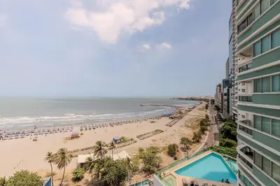 a view of the beach from the balcony of a building at Espectacular vista al mar - Edificio Infinito 1002 in Cartagena de Indias
