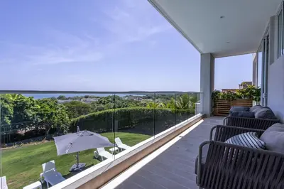 a balcony with a view of the ocean at Brand new 4BR Villa at Calablanca in Cartagena de Indias
