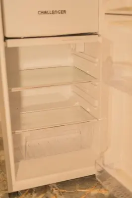 an empty refrigerator with its door open at Almería Apt, Stylish Modern Studio Near Centro in Cartagena de Indias