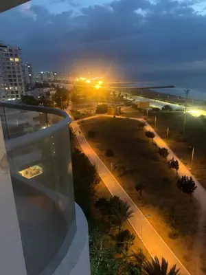 a view of a street at night from a building at CB Lujoso Apartasuit -Vista al mar-linda piscina-cerca al Aeropuerto in Cartagena de Indias