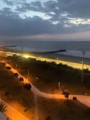 a view of a beach at night with the ocean at CB Lujoso Apartasuit -Vista al mar-linda piscina-cerca al Aeropuerto in Cartagena de Indias