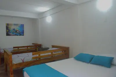a room with two beds in a room at Mango Tree Island 420 in Tierra Bomba