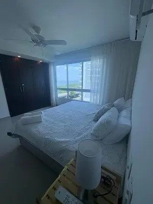 a bedroom with a large bed with a window at Apartamento en Morros in Cartagena de Indias