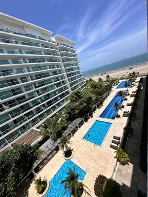 an aerial view of a resort with two pools and a beach at Exclusivo Apartamento con playa y piscinas Morros Cartagena in Cartagena de Indias