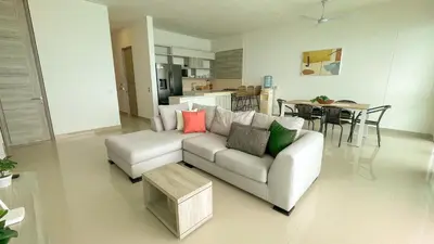 a living room with a couch and a table at Magico Apartamento Frente al Mar 3 Habitaciones BM91 in Coveñitas