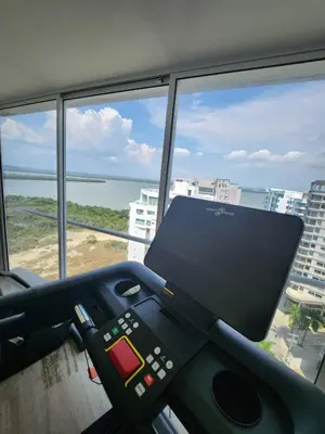 an office with a view of the ocean and a laptop at Exclusive Apartment with Private Jacuzzi in Cartagena de Indias