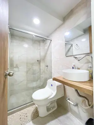 a bathroom with a toilet and a shower and a sink at Celeste Caribe 101A in Coveñas