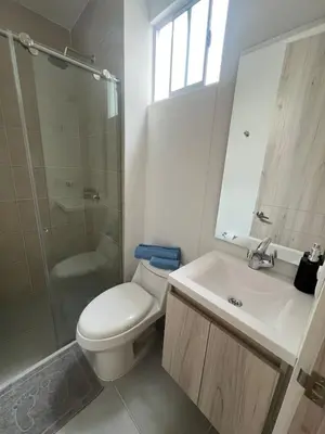 a bathroom with a toilet and a sink and a shower at Apartamento Cartagena Moderno y Comodo in Manzanillo del Mar