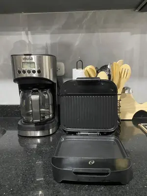 a kitchen counter with a coffee maker and a toaster at New modern apartment in Barranquilla