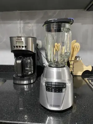 a blender sitting on a counter next to a coffee maker at New modern apartment in Barranquilla