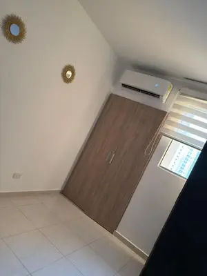 a room with a door in the corner of a room at ÁME Living in Cartagena de Indias