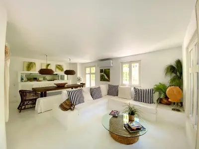 a living room with a white couch and a table at Apartment in the Historical Center of Cartagena in Cartagena de Indias