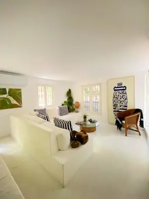 a white living room with a white couch and chairs at Apartment in the Historical Center of Cartagena in Cartagena de Indias