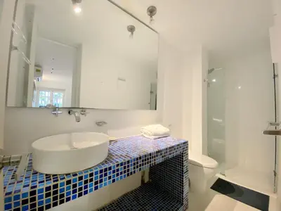 a bathroom with a sink and a mirror at Apartment in the Historical Center of Cartagena in Cartagena de Indias