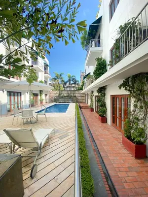 a courtyard of a building with a swimming pool at Apartamento en el centro historico de Cartagena in Cartagena de Indias