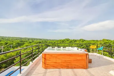 a bath tub sitting on top of a balcony at Casa BaruGrande in Cartagena de Indias