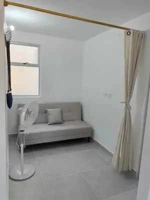 a living room with a couch and a window at Encanto de Serena in Manzanillo del Mar