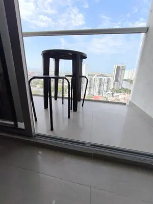 a black stool sitting on top of a balcony at Cartagena Royal Residences 903 in Cartagena de Indias