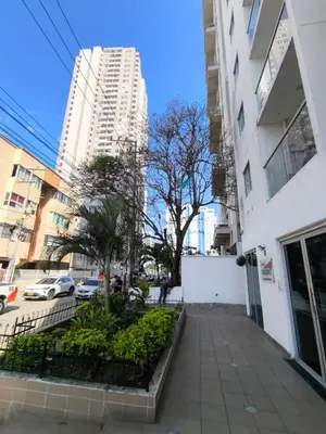 a sidewalk in the middle of a city with buildings at Cartagena Royal Residences 903 in Cartagena de Indias