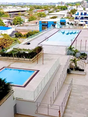 an image of a swimming pool at a resort at Beachfront Apartment - Pool - Jacuzzi - Wi-Fi in Cartagena de Indias