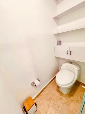 a bathroom with a toilet and two rolls of toilet paper at Beachfront Apartment - Pool - Jacuzzi - Wi-Fi in Cartagena de Indias