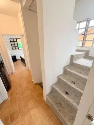 a hallway with stairs in a building with a window at Tropical Nomad Hub - Pool - Super Fast Wi-Fi in Santa Veronica