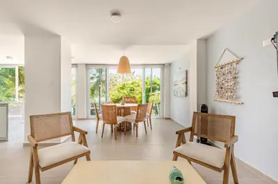 a dining room with a table and chairs at Vacation Home Escape & Villa with pool in El Morro